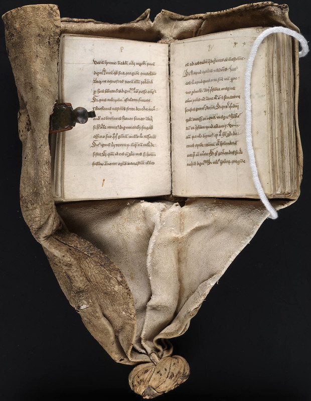 A copy of a book lying open on top of a cloth, shared by Beinecke Library under a CC BY-SA licence