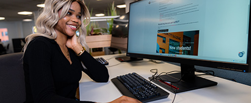 student on computer in Harrison Library IT suite