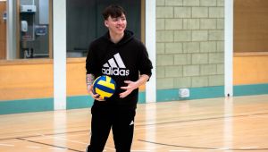 Student with ball in hall