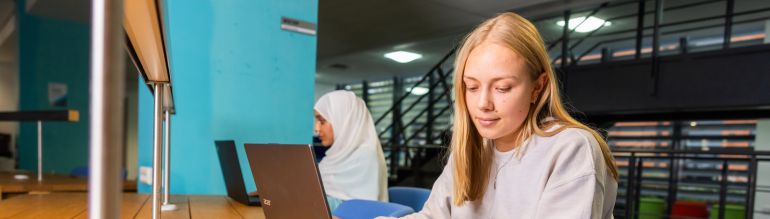 A female student working on computer