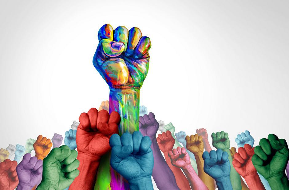 Graphic of raised fists in various different colours, one large fist in the centre of the rest splashed with a mixture of colours