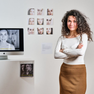 student with artwork on mac