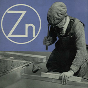 An industrial worker using tools on wood