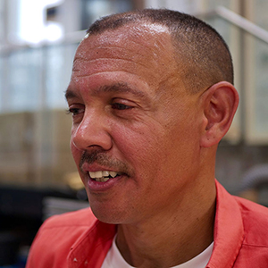 Portrait of Glass graduate, Chris Day he is smiling