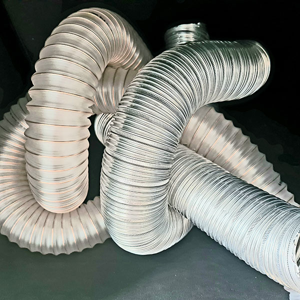 large diameter shinny, corrugated industrial tubbing sculpted into a knot on a black background