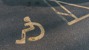 disabled parking sticker on parking space