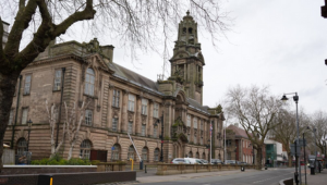 A historical building in Walsall, with an arching doorway and a tall tower