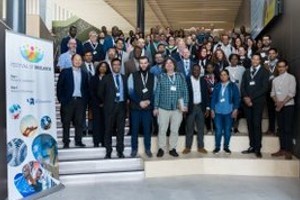 A crowd of participants in the Celebration of Research event standing on a staircase in Springfield Campus