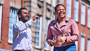 Students standing outside the university looking smart