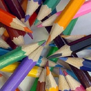 Image of differently coloured pencil-heads arranged together.