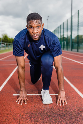Student taking his marks on the running track
