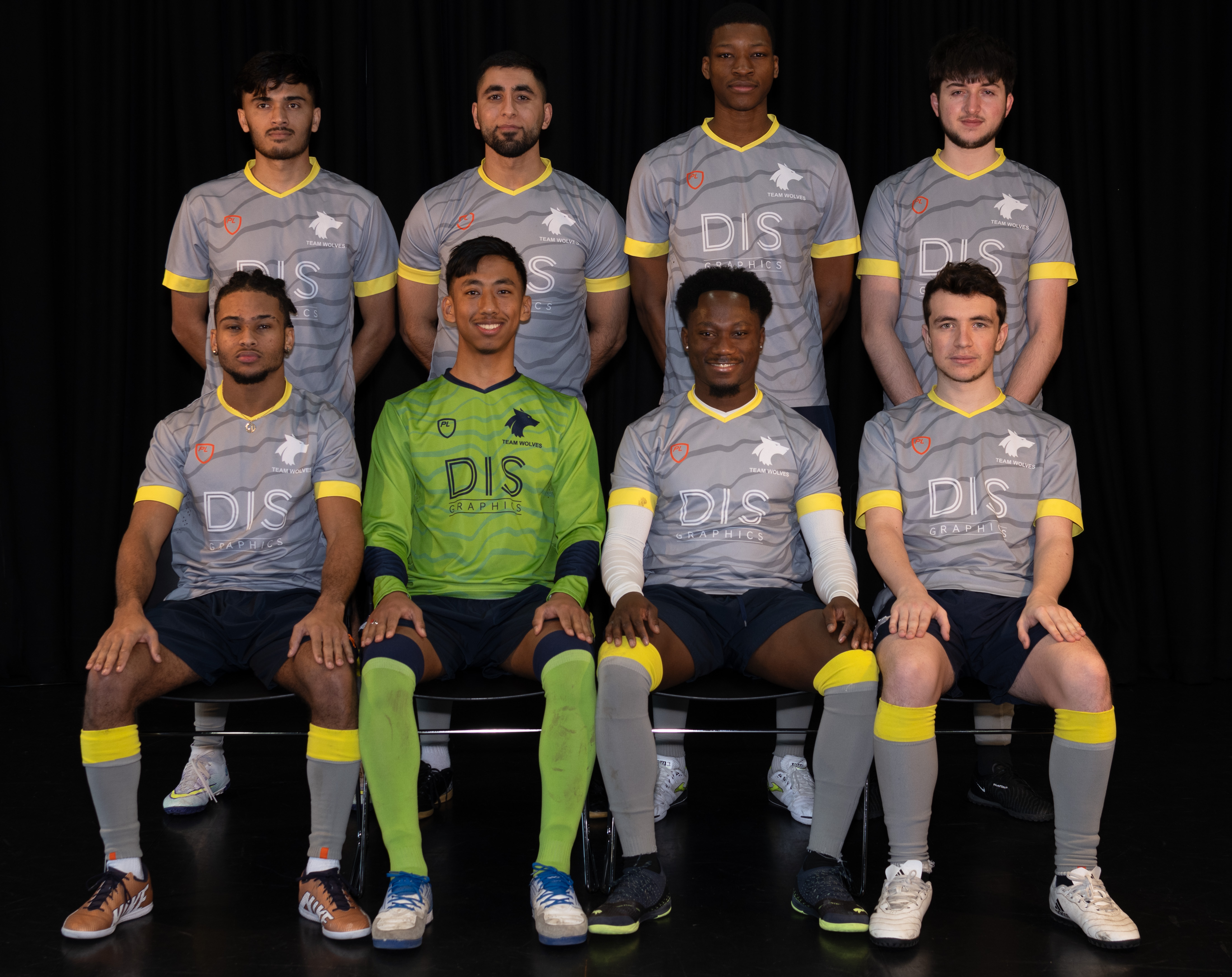 Photograph of the University of Wolverhampton men futsal team for 2023-24, posed together wearing matching grey uniforms with yellow details.