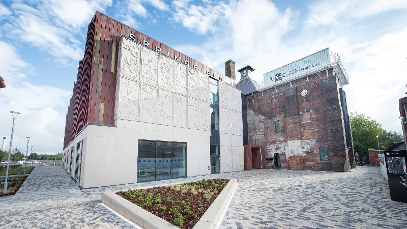 Exterior of Springfield campus with signage displaying Springfield and the University of Wolverhampton logos on the walls
