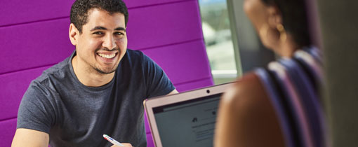 An applicant speaking to a member of admissions staff